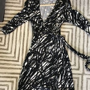 Black and white abstract print wrap dress